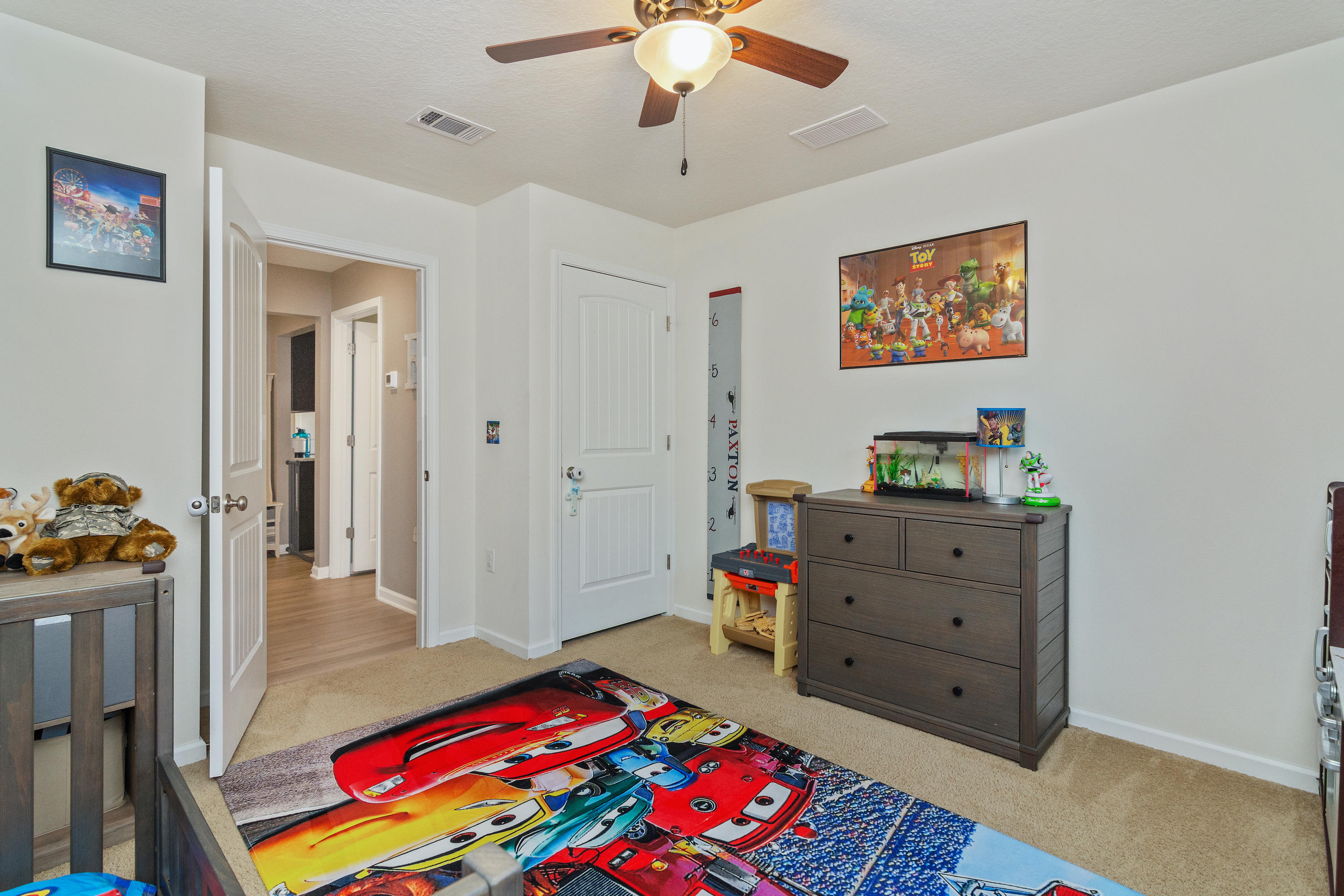 501 Merganser Way Crestview, FL 32539 - Photo 17 of 34 a living room with furniture and a baby crib