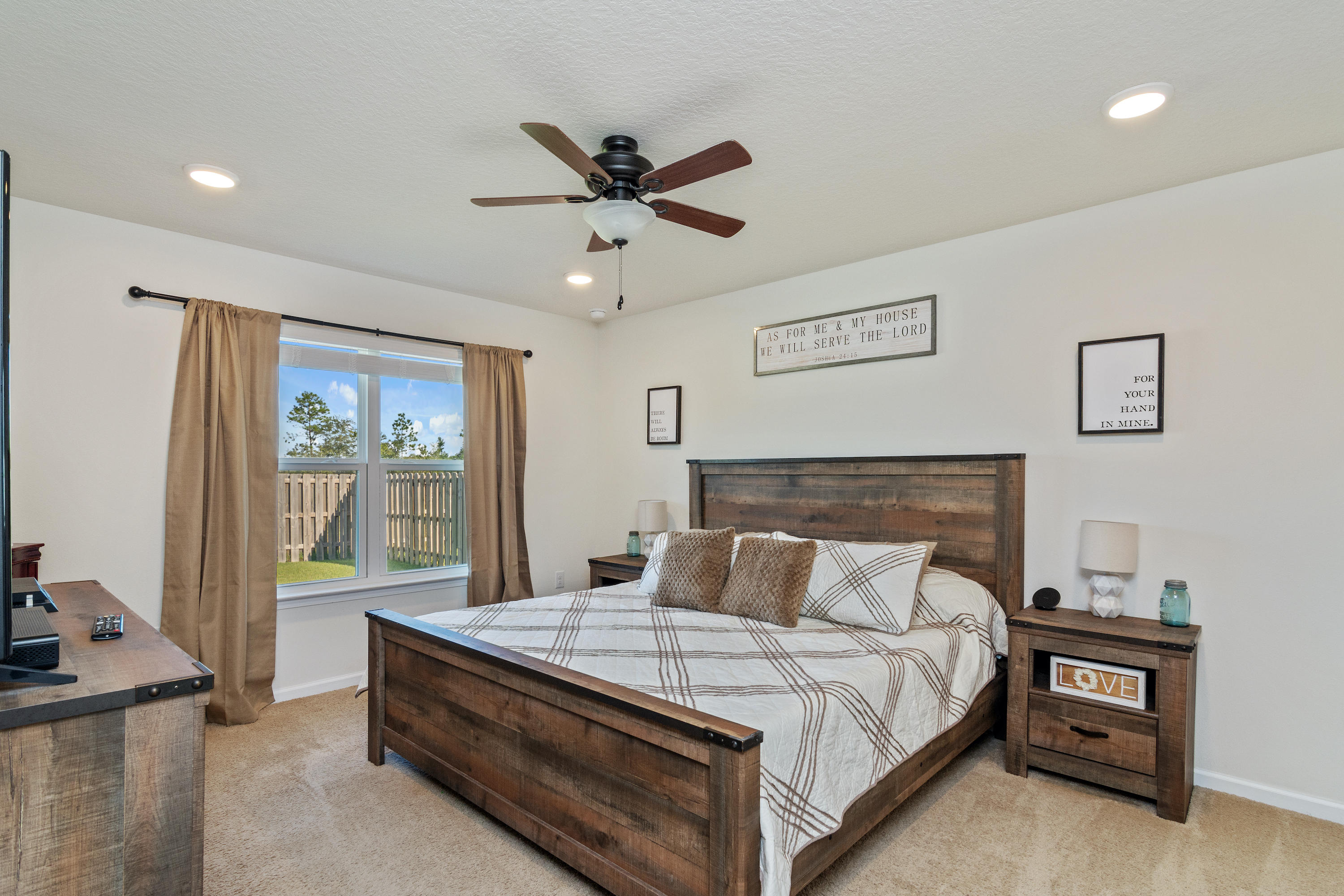 501 Merganser Way Crestview, FL 32539 - Photo 18 of 34 a bedroom with a bed and window