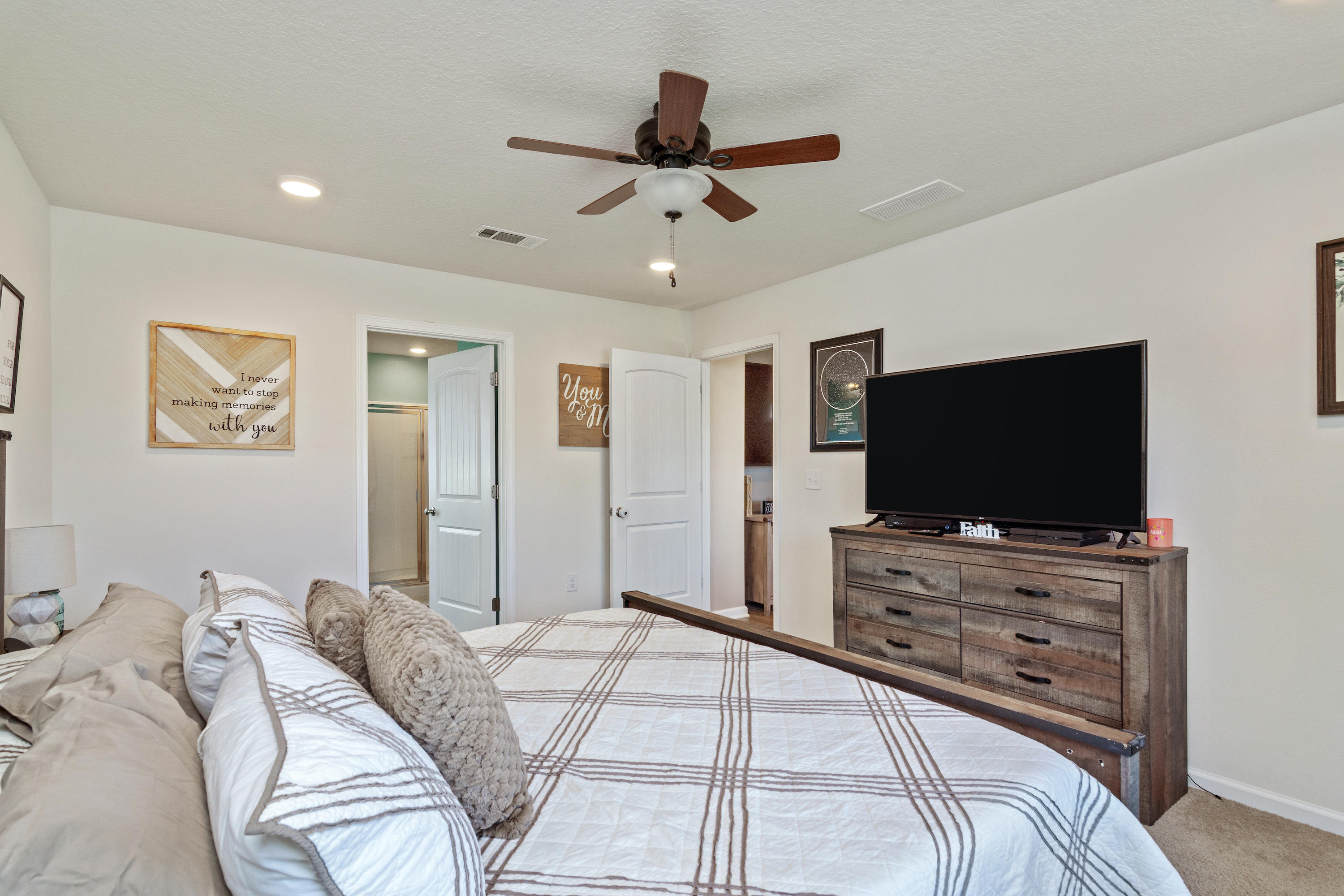 501 Merganser Way Crestview, FL 32539 - Photo 19 of 34 a bedroom with a bed and a flat screen tv