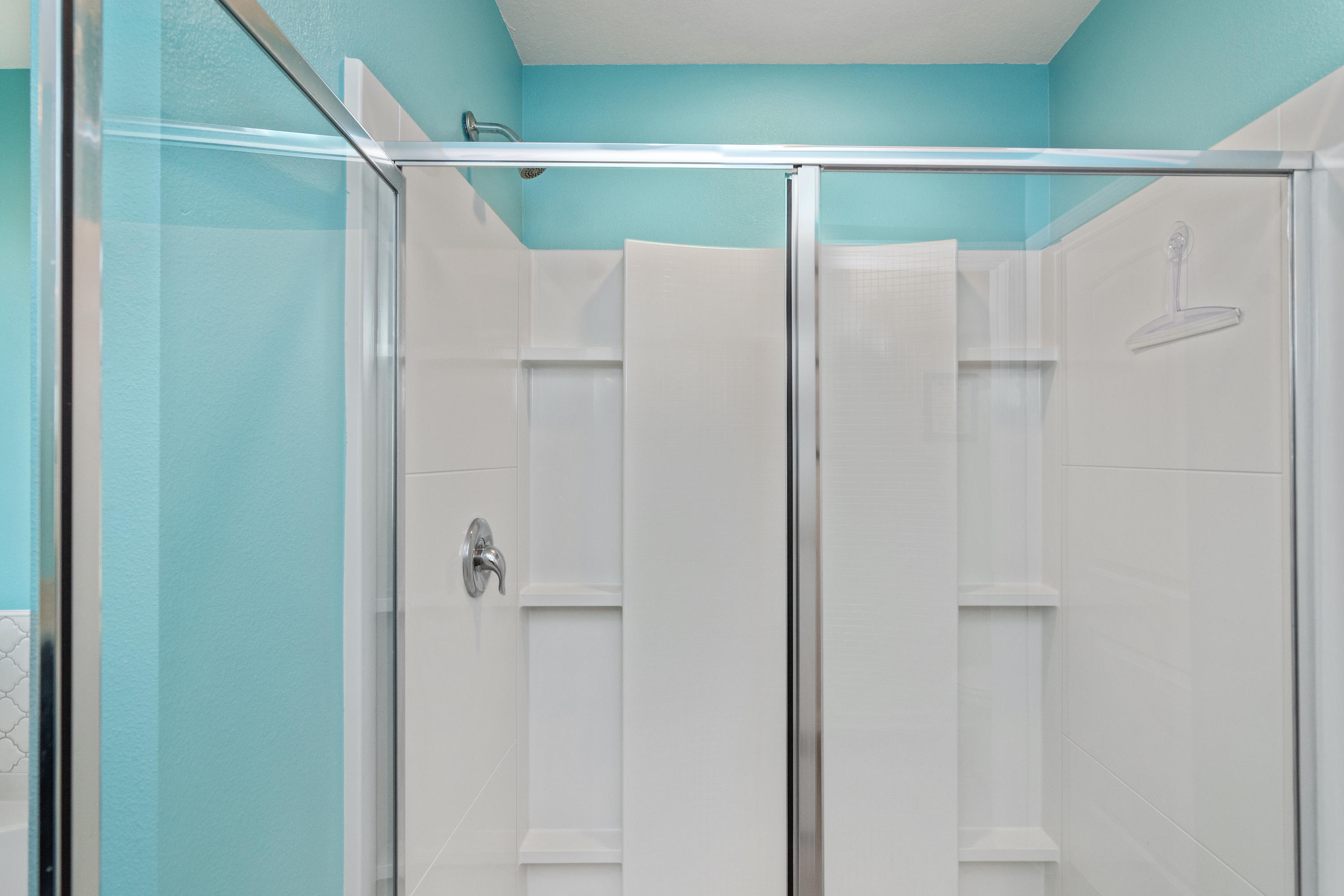 501 Merganser Way Crestview, FL 32539 - Photo 22 of 34 a bathroom with a glass shower door and a shower
