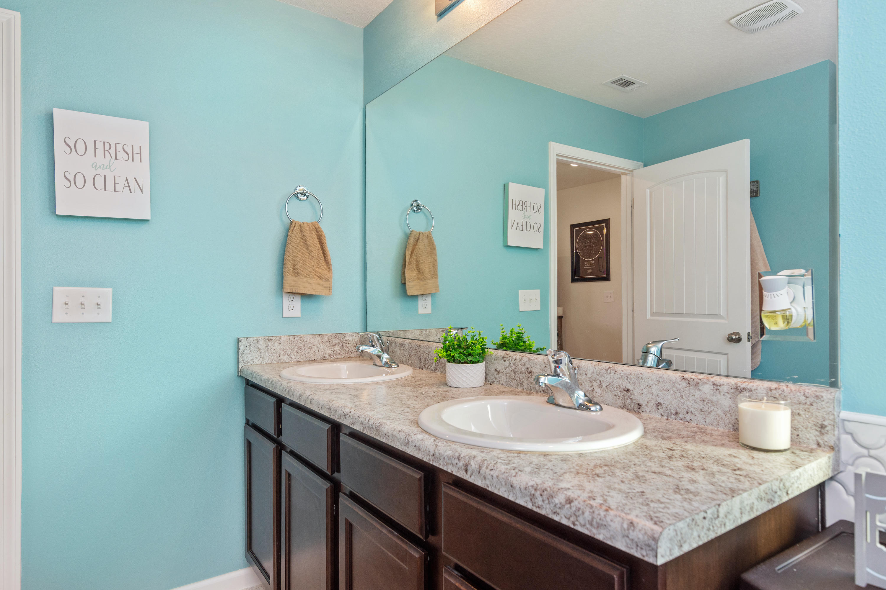 501 Merganser Way Crestview, FL 32539 - Photo 23 of 34 a bathroom with a granite countertop sink and a mirror