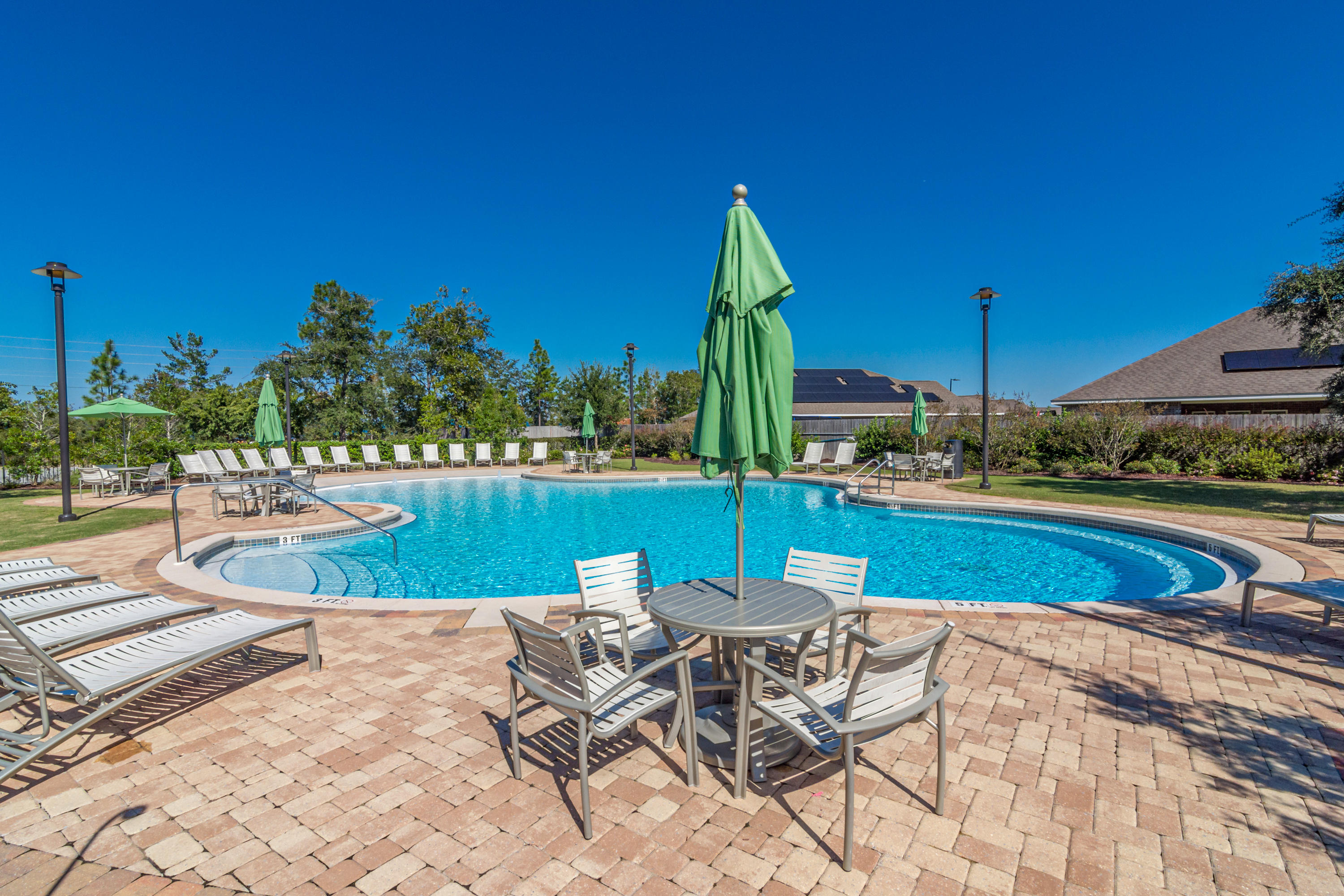 501 Merganser Way Crestview, FL 32539 - Photo 33 of 34 a view of a swimming pool with a lounge chairs