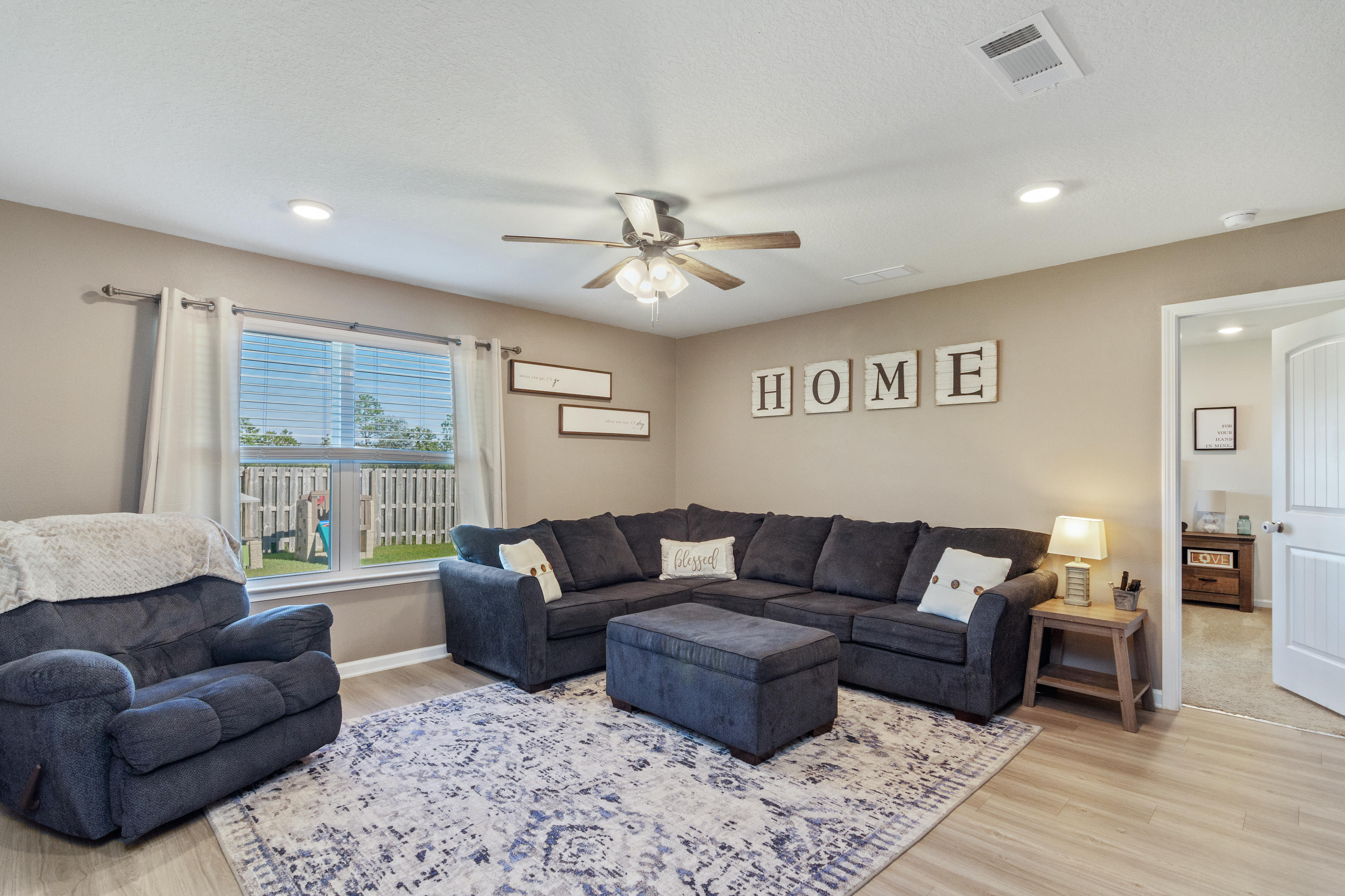 501 Merganser Way Crestview, FL 32539 - Photo 9 of 34 a living room with furniture and a large window