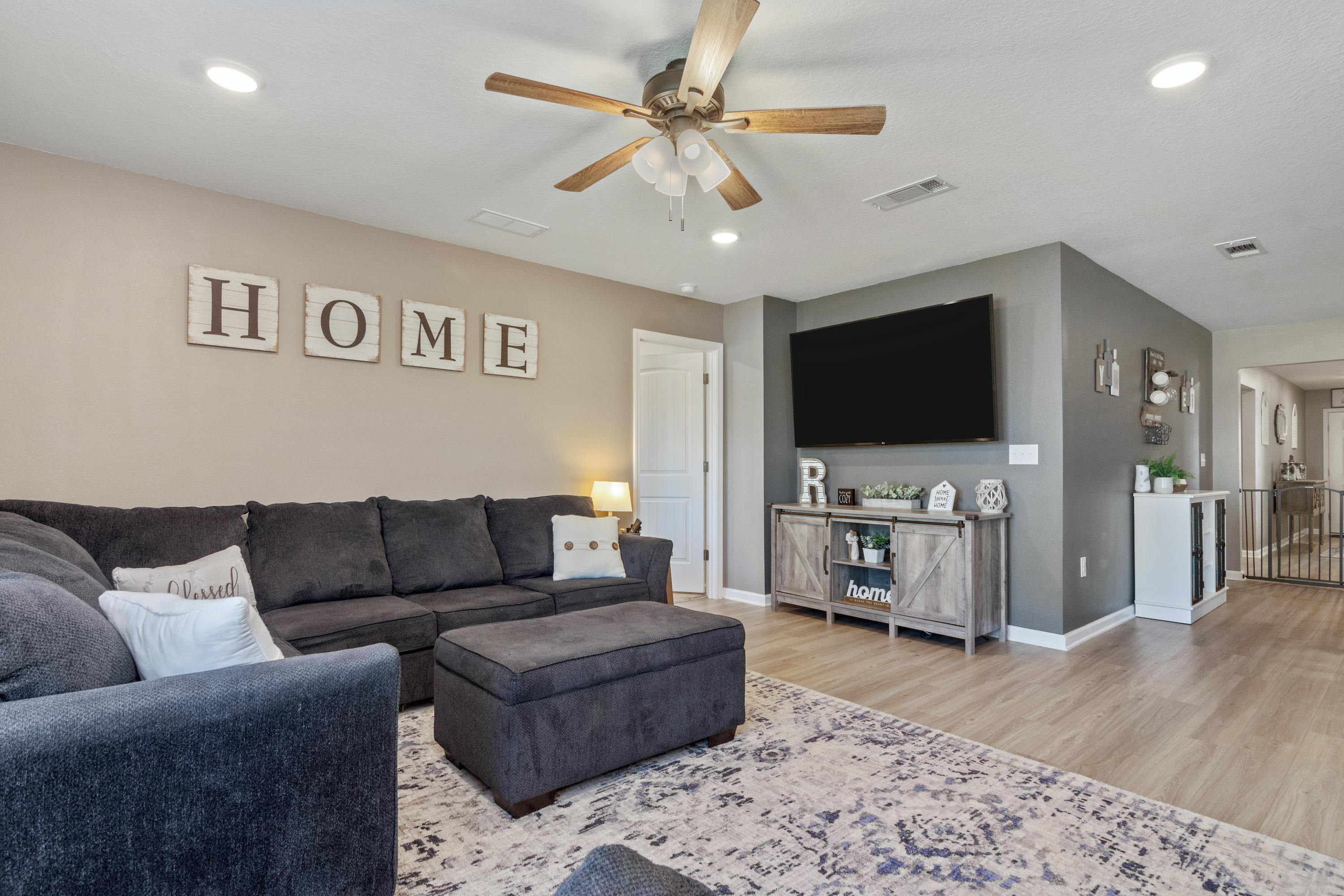 501 Merganser Way Crestview, FL 32539 - Photo 10 of 34 a living room with furniture and a flat screen tv