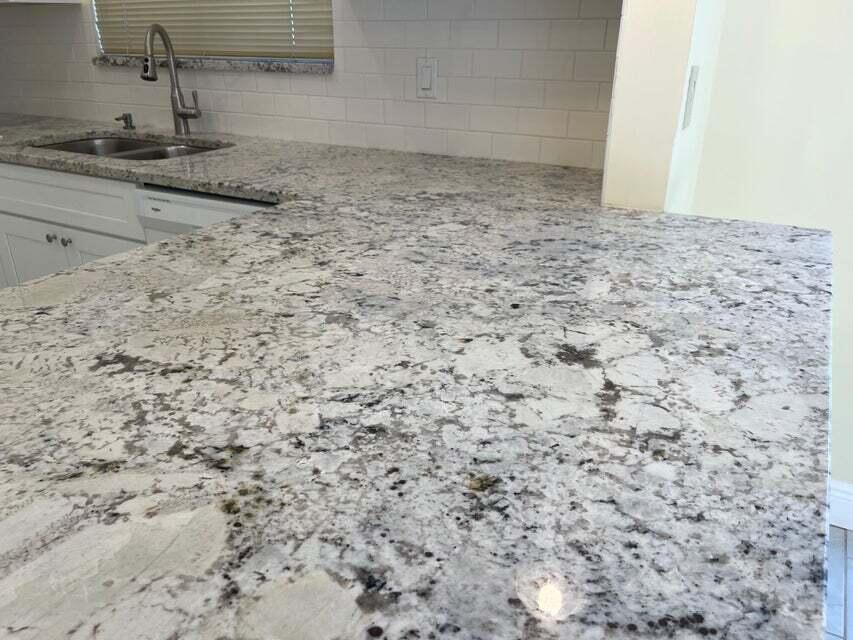 7722 Solimar Circle Boca Raton, FL 33433 - Photo 11 of 36 a view of a granite countertop sink