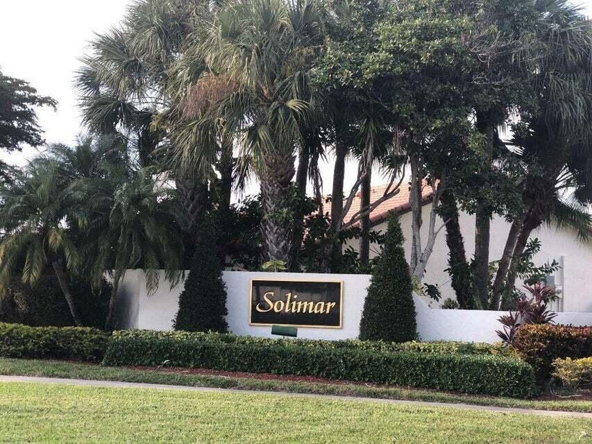 7722 Solimar Circle Boca Raton, FL 33433 - Photo 15 of 36 a view of a street with large trees