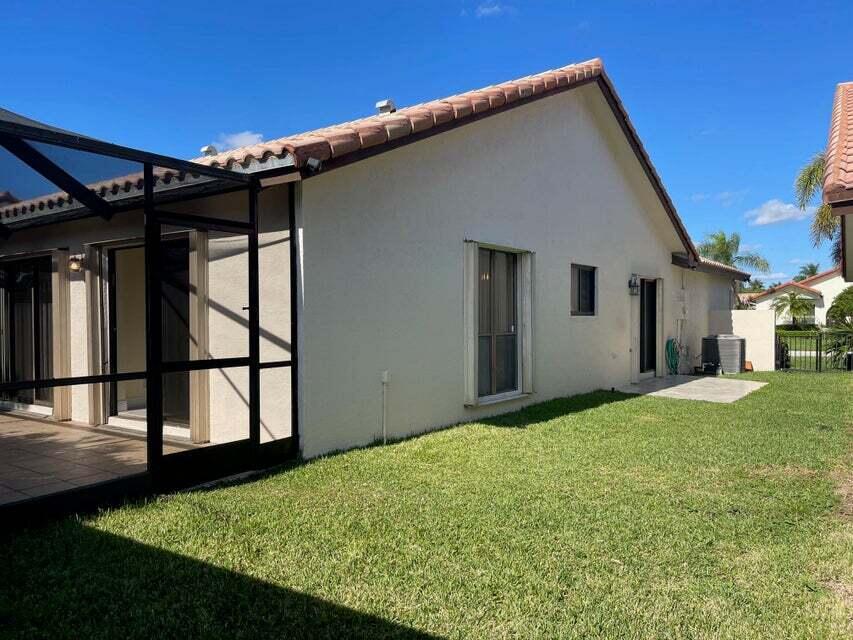7722 Solimar Circle Boca Raton, FL 33433 - Photo 18 of 36 a backyard of a house with lots of green space
