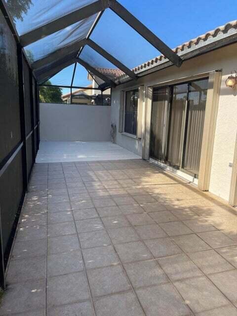 7722 Solimar Circle Boca Raton, FL 33433 - Photo 20 of 36 a view of a livingroom with furniture and an umbrella