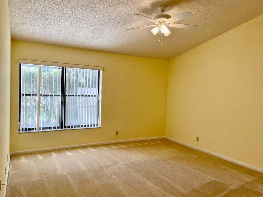 7722 Solimar Circle Boca Raton, FL 33433 - Photo 23 of 36 an empty room with a empty space and a window