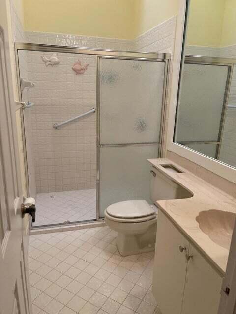 7722 Solimar Circle Boca Raton, FL 33433 - Photo 25 of 36 a bathroom with a sink a toilet and shower