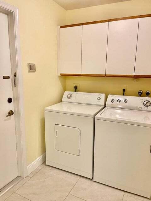 7722 Solimar Circle Boca Raton, FL 33433 - Photo 26 of 36 a utility room with dryer and washer