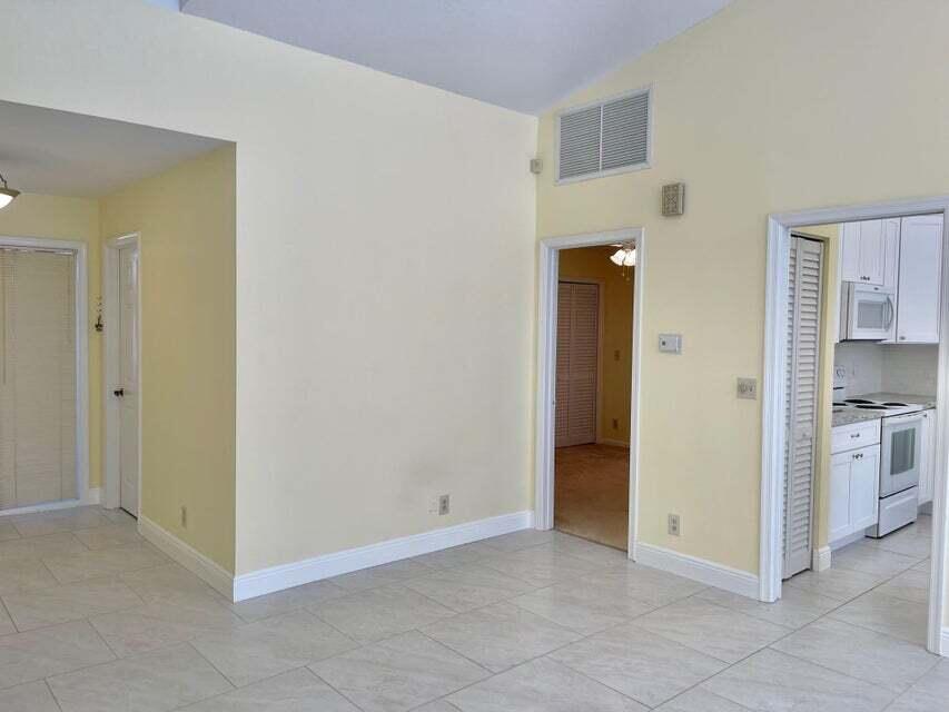 7722 Solimar Circle Boca Raton, FL 33433 - Photo 28 of 36 a view of a kitchen with a sink and a refrigerator