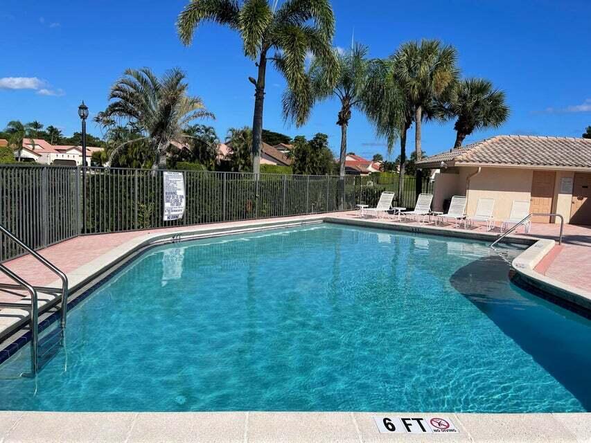 7722 Solimar Circle Boca Raton, FL 33433 - Photo 34 of 36 a swimming pool with outdoor seating and yard