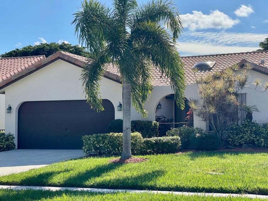 7722 Solimar Circle Boca Raton, FL 33433 - Photo 36 of 36 a view of a yard in front of a house