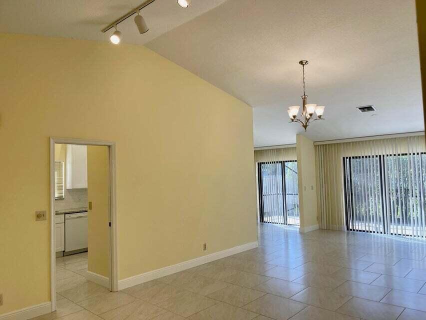 7722 Solimar Circle Boca Raton, FL 33433 - Photo 6 of 36 a view of an empty room with a window