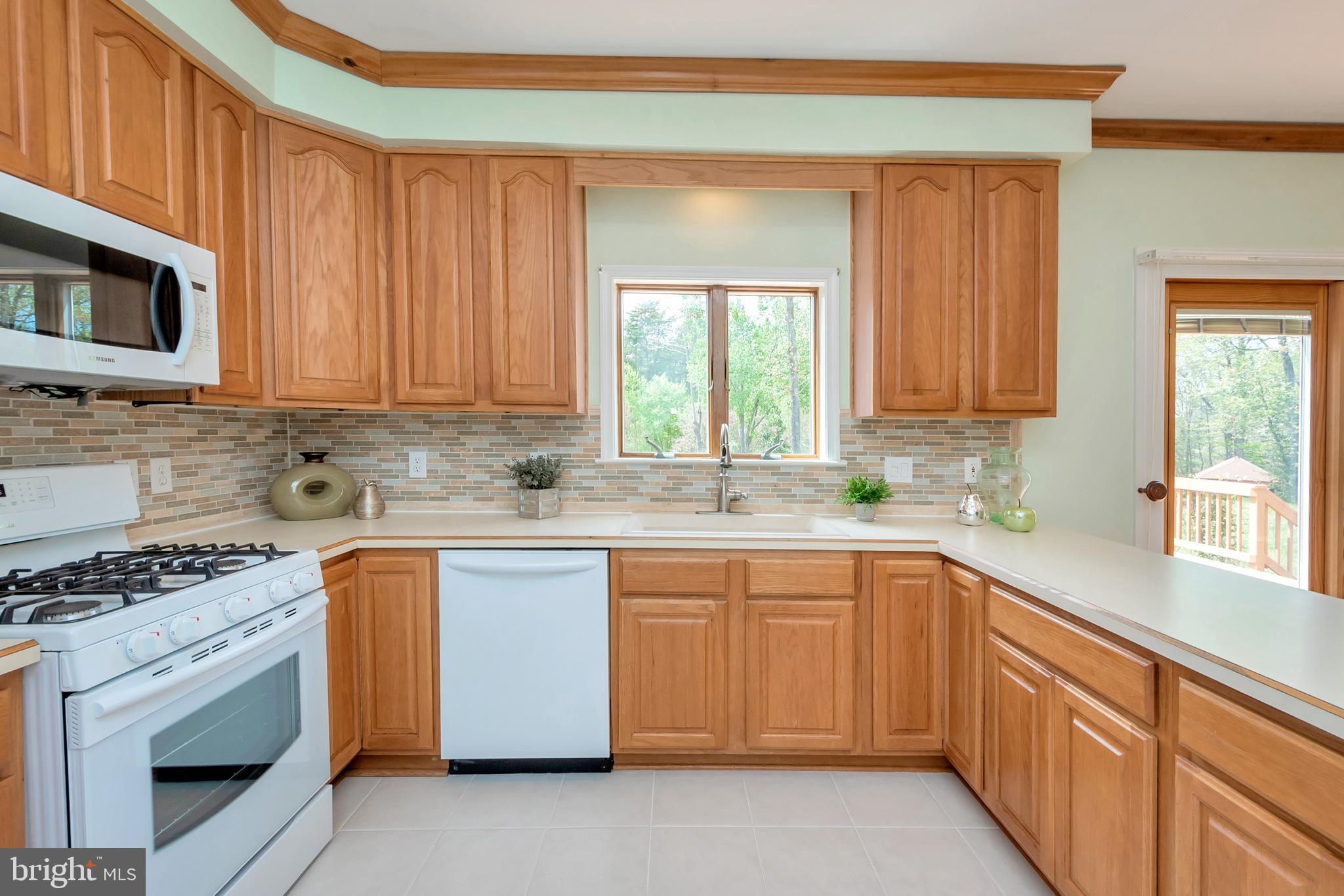 3358 White Hall Road King George, VA 22485 - Photo 28 of 56 Gas oven and range, dishwasher and microwave.