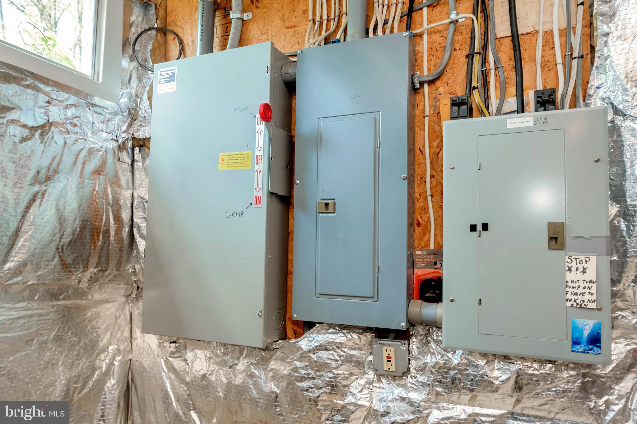 3358 White Hall Road King George, VA 22485 - Photo 51 of 56 Power boxes with whole house generator switch.
