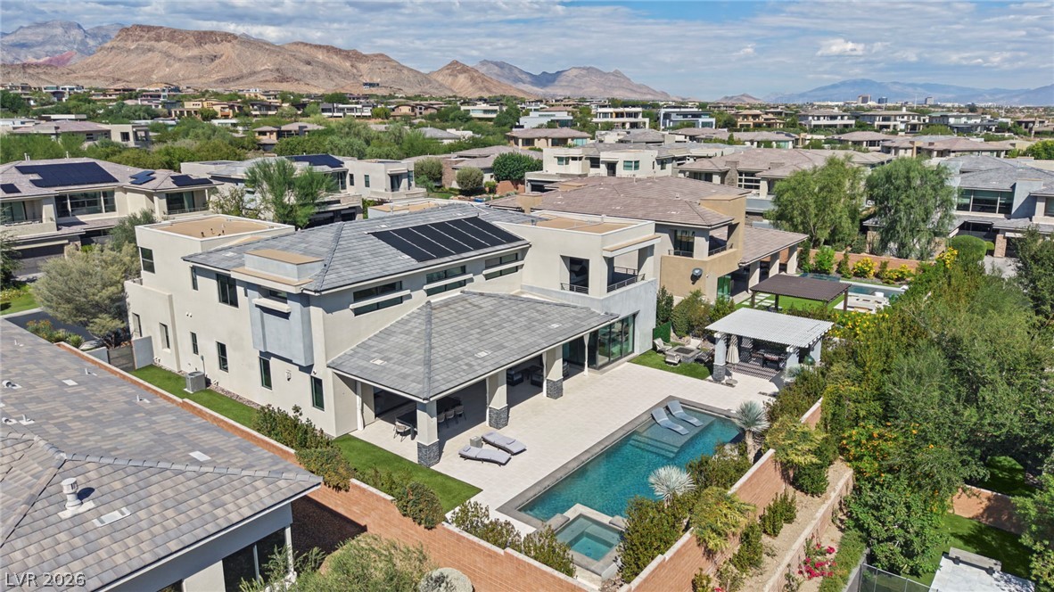 4208 Lapis Ridge Court Las Vegas, NV 89135 - Photo 51 of 61 Dramatic mountain vistas frame this modern multi-level residence featuring a pristine swimming pool.