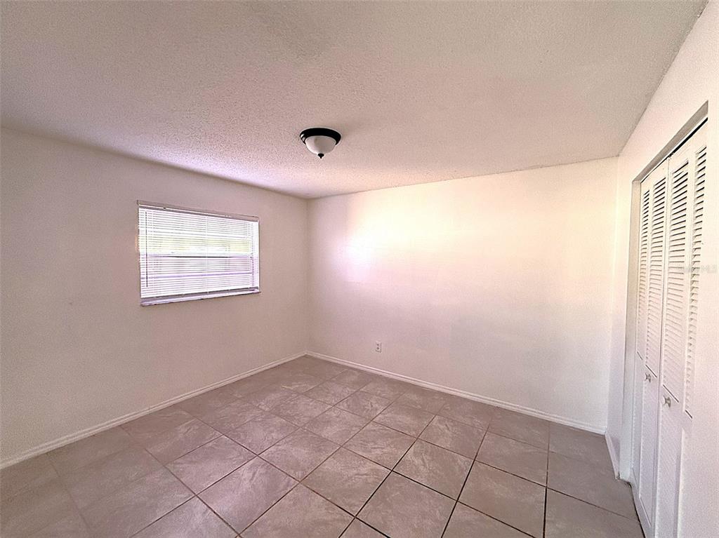 698 Michigan Court, Unit 4 St. Cloud, FL 34769 - Photo 11 of 17 a view of an empty room and window