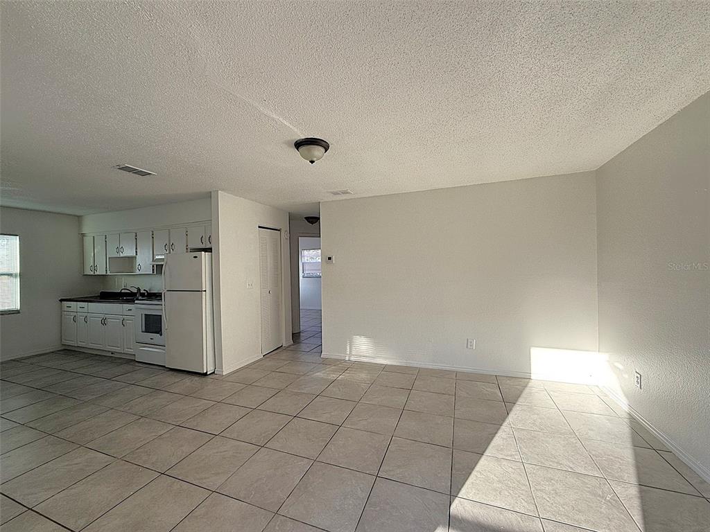698 Michigan Court, Unit 4 St. Cloud, FL 34769 - Photo 6 of 17 a view of a kitchen with a sink