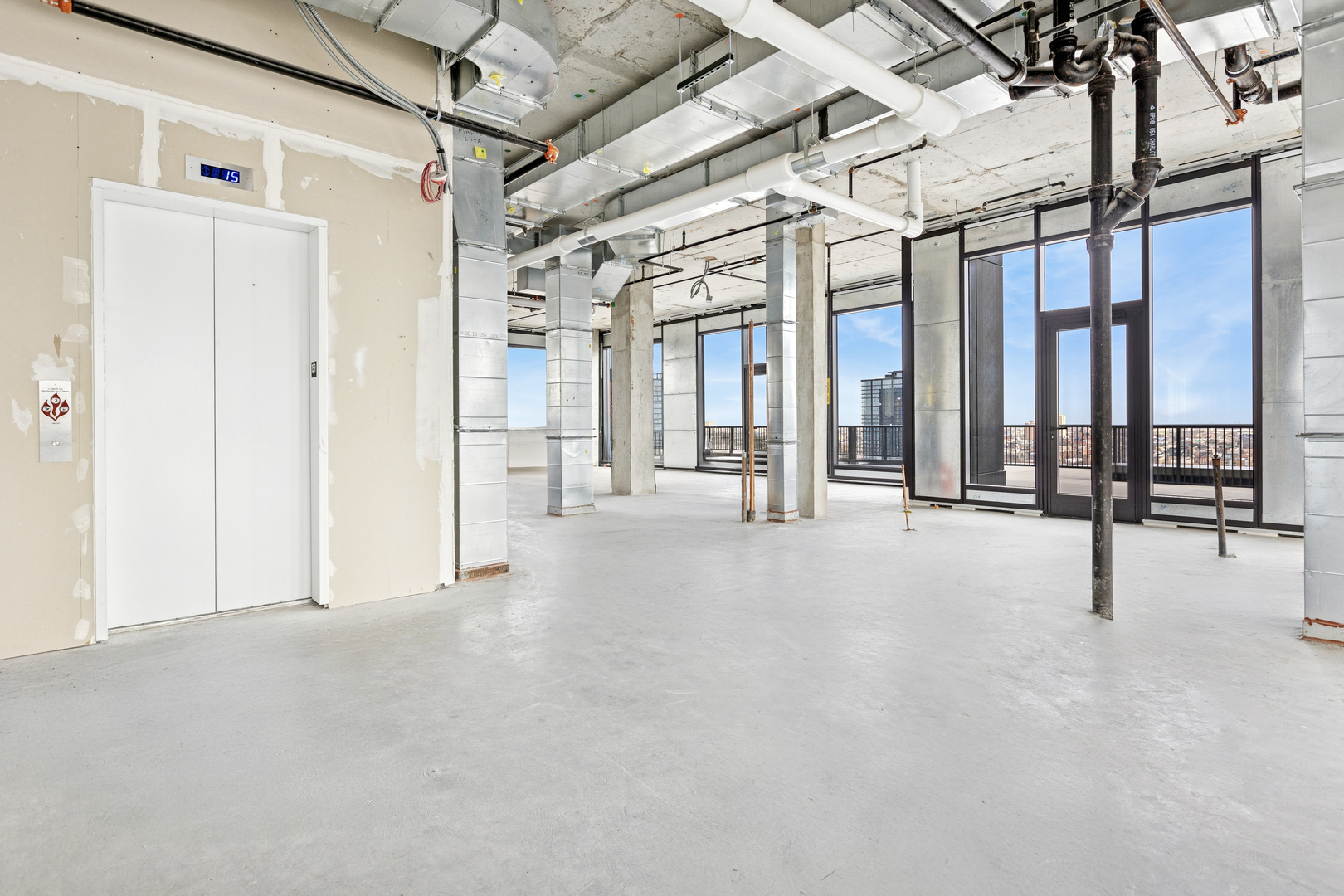 21 North May Street, Unit 1502 Chicago, IL 60607 - Photo 26 of 42 a view of a building with a glass door