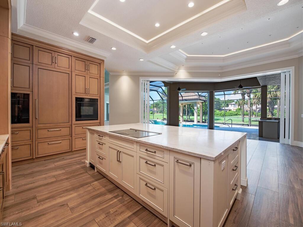 2835 Silverleaf Lane Naples, FL 34105 - Photo 14 of 50 a large kitchen with stainless steel appliances granite countertop a large counter top and a refrigerator