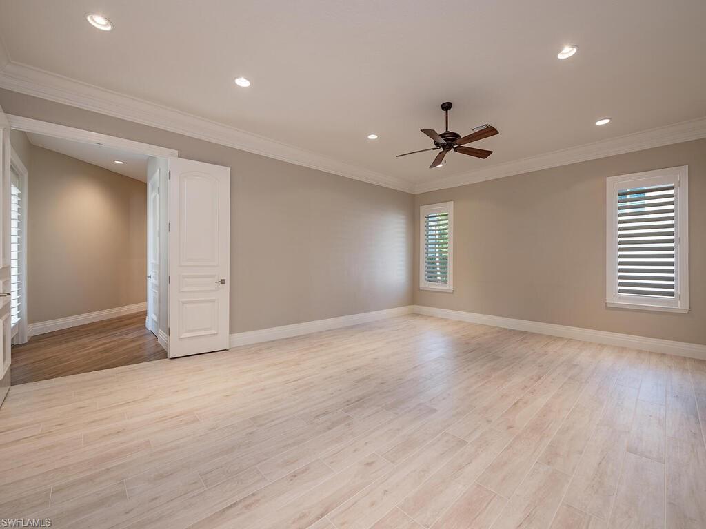 2835 Silverleaf Lane Naples, FL 34105 - Photo 26 of 50 a view of an empty room with a window