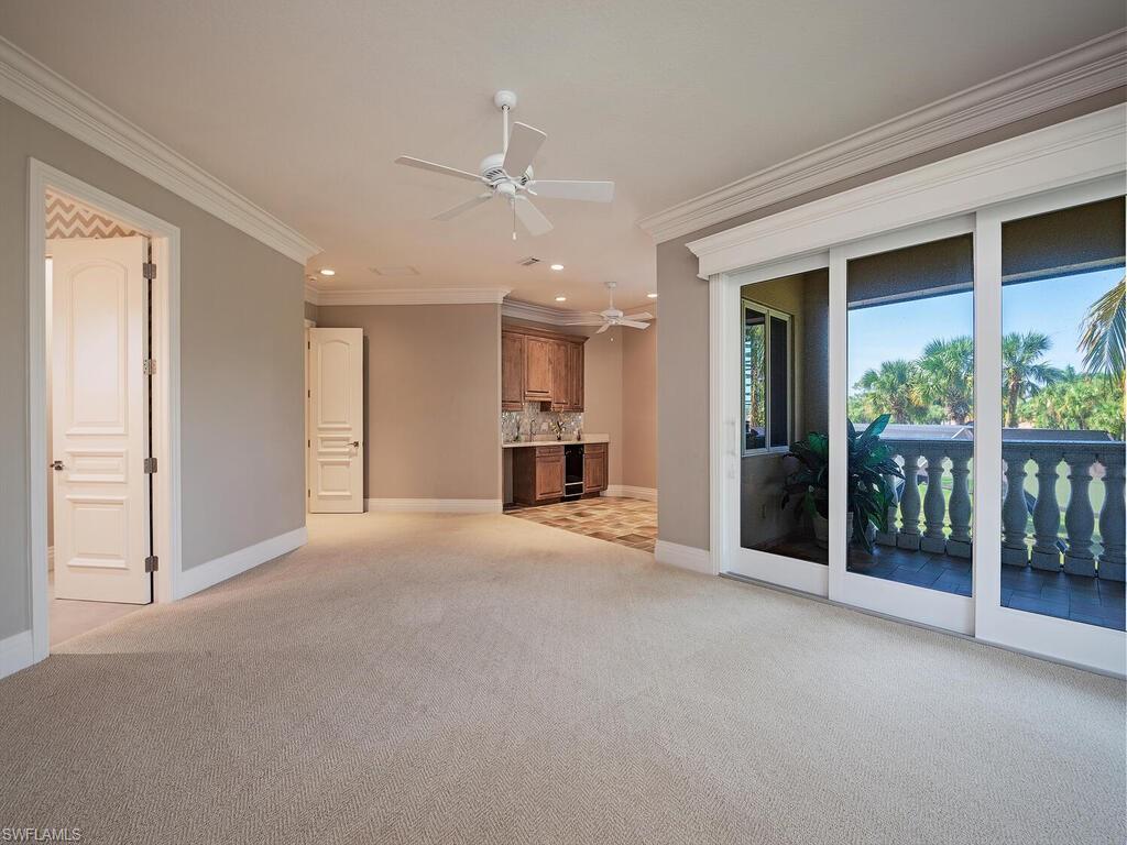 2835 Silverleaf Lane Naples, FL 34105 - Photo 31 of 47 a view of empty room with a fireplace and windows