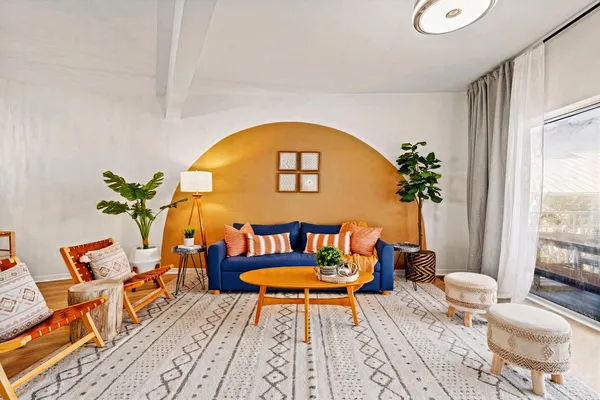 a living room with a couch and a table