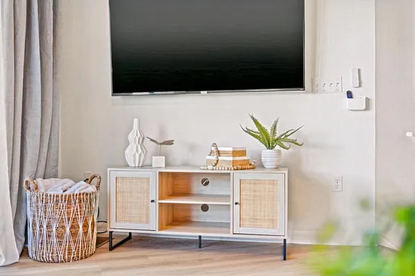 a living room with furniture and a flat screen tv