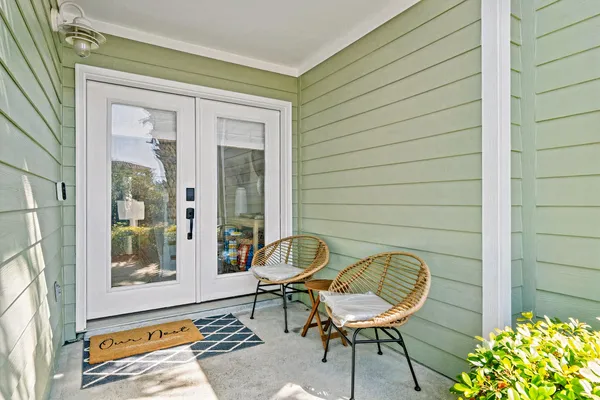 a backyard of a house with table and chairs