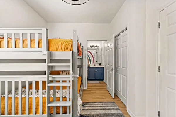 a bathroom with a sink a toilet and shower curtain