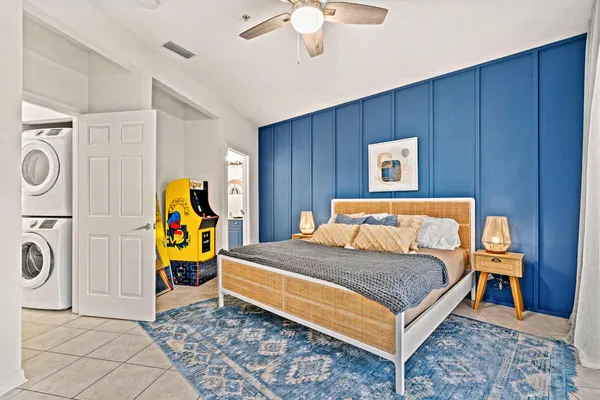 a bedroom with a bed and a chandelier