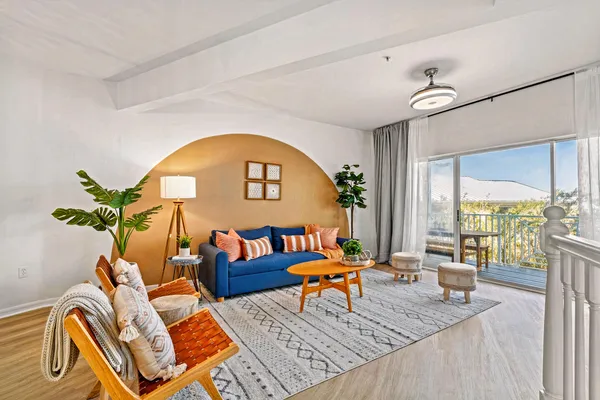 a living room with furniture and a large window