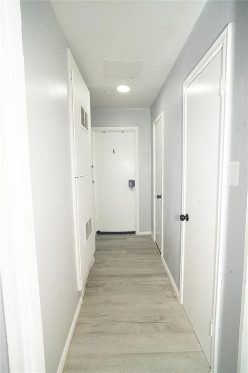 2136 Ridgeway Street Arlington, TX 76010 - Photo 14 of 32 a view of a hallway with wooden floor