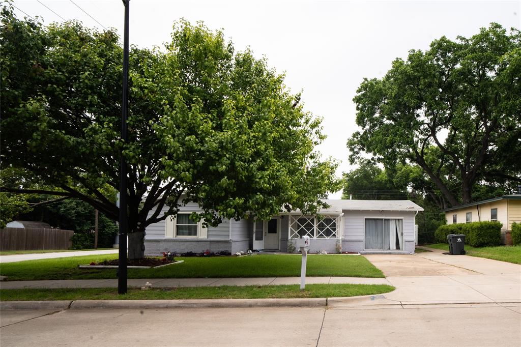2136 Ridgeway Street Arlington, TX 76010 - Photo 2 of 32 a front view of a house with a yard and tree s