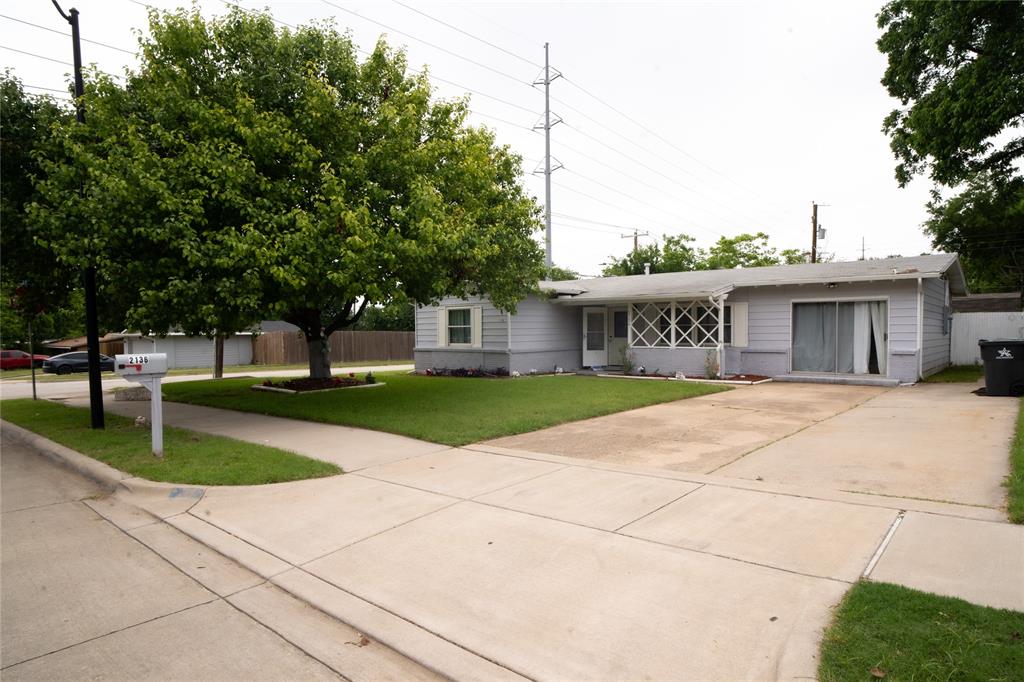 2136 Ridgeway Street Arlington, TX 76010 - Photo 3 of 32 a view of house with outdoor space and tree s