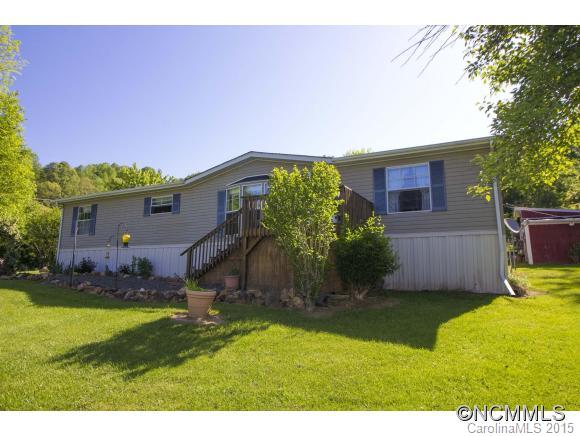 442 Van Arrington Road Clyde, NC 28721 - Photo 2 of 22 a view of a house with a yard