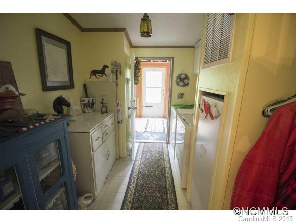 442 Van Arrington Road Clyde, NC 28721 - Photo 11 of 22 a bathroom with a sink a mirror and shower
