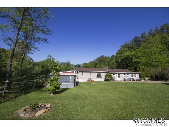 442 Van Arrington Road Clyde, NC 28721 - Photo 18 of 22 a view of a house with a yard