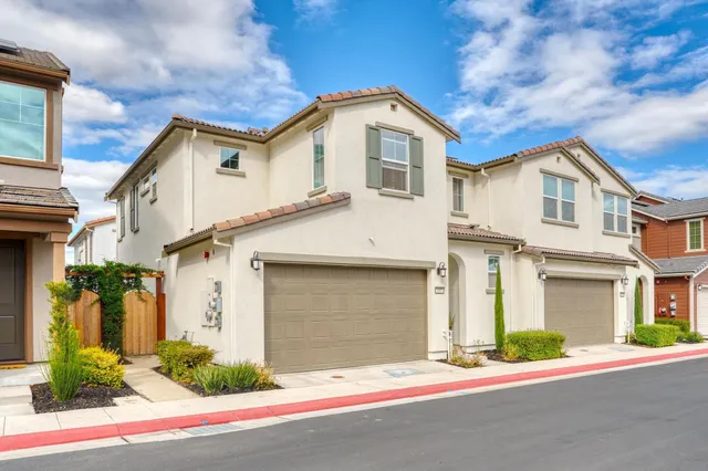 a front view of a house with garage