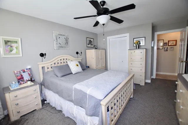 a bedroom with a bed and a table