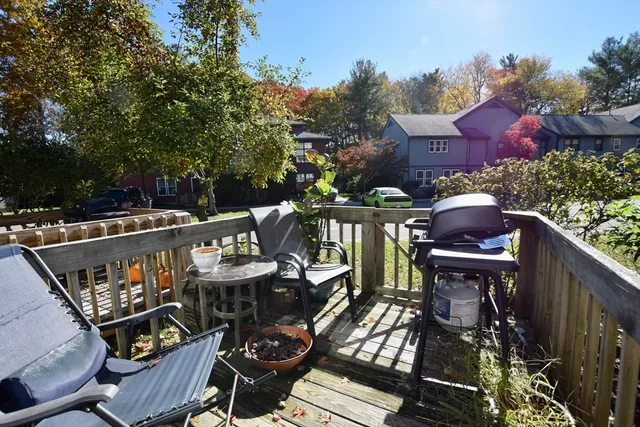 a view of a house with wooden fence