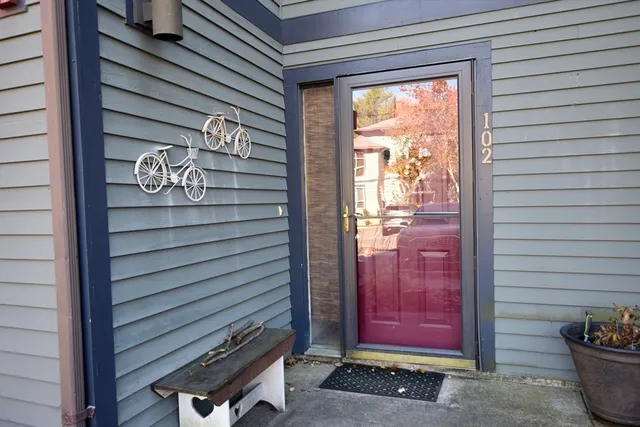 a kitchen with granite countertop a sink cabinets and stainless steel appliances