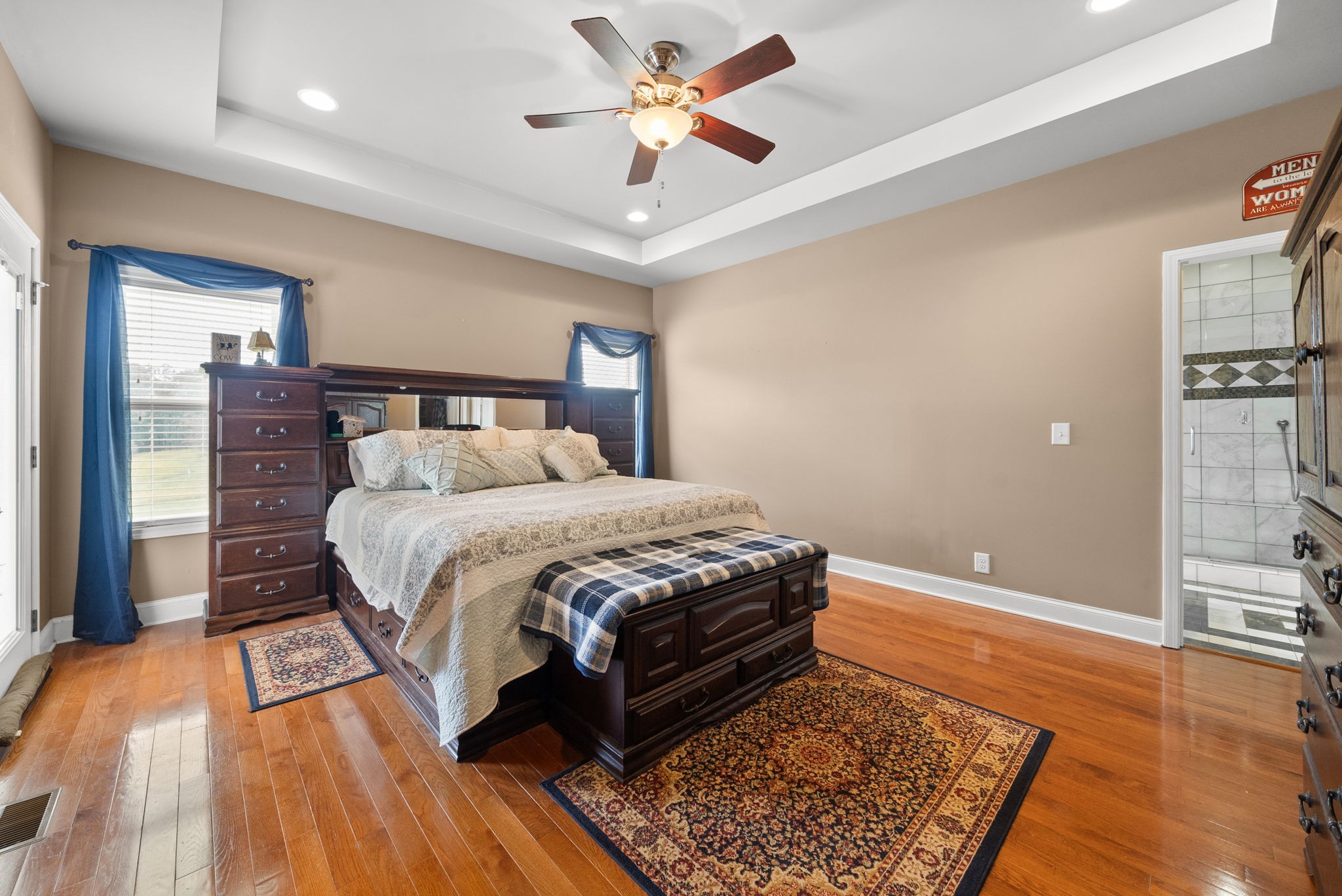 4940 Marion Road Cunningham, TN 37052 - Photo 18 of 43 a bed room with a bed and a chandelier