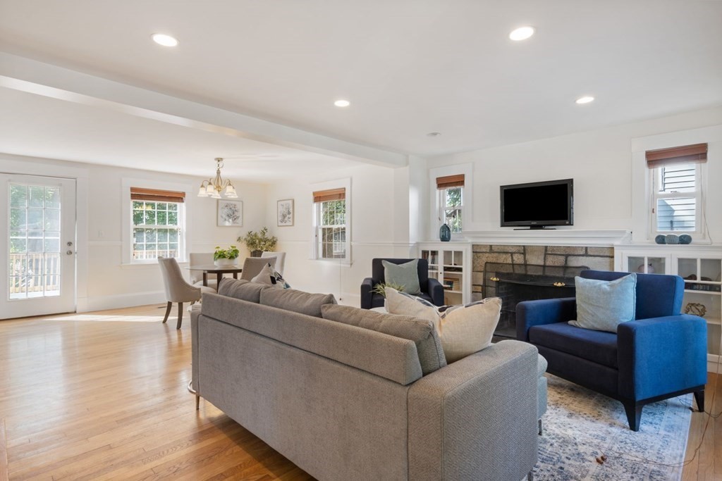 43 Hackensack Road Brookline, MA 02467 - Photo 11 of 24 a living room with furniture a fireplace and a flat screen tv