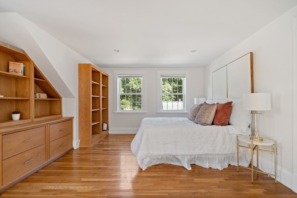 43 Hackensack Road Brookline, MA 02467 - Photo 14 of 24 a bedroom with a bed and wooden floor