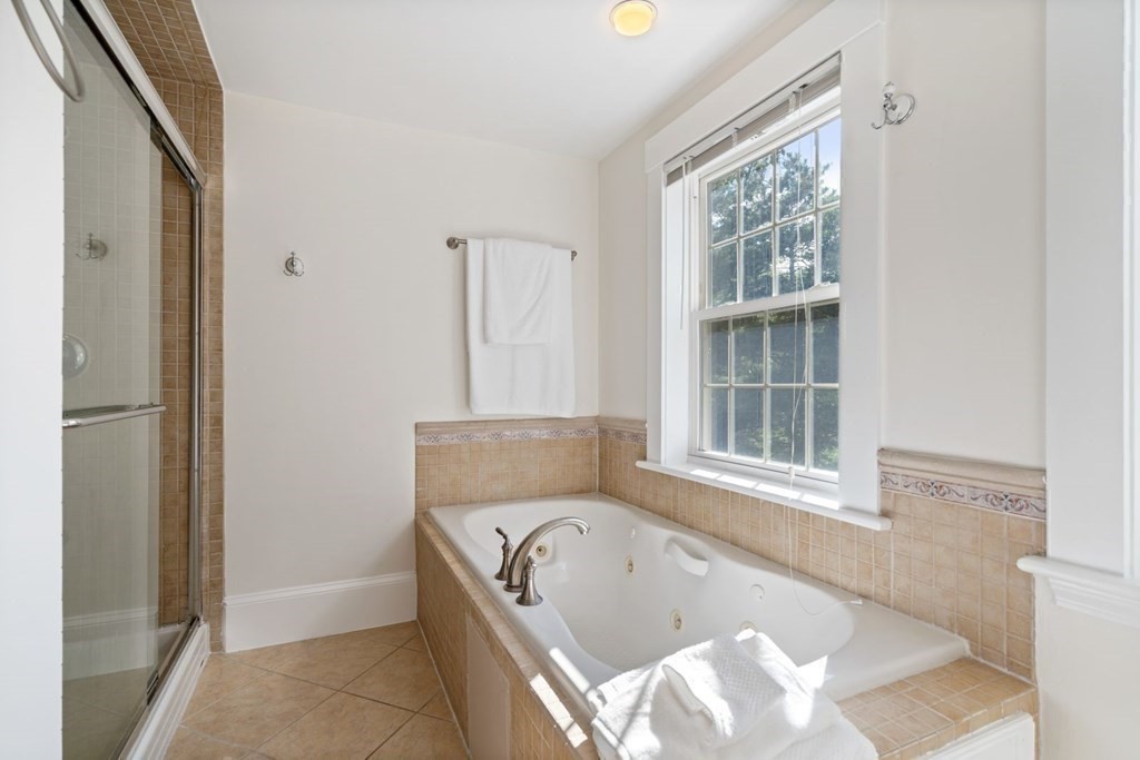 43 Hackensack Road Brookline, MA 02467 - Photo 18 of 24 a bath tub sitting in a bathroom next to a window