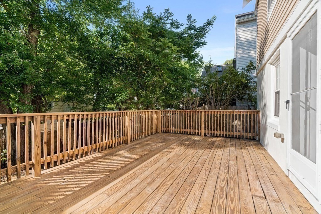 43 Hackensack Road Brookline, MA 02467 - Photo 5 of 24 a balcony with view of trees in the background