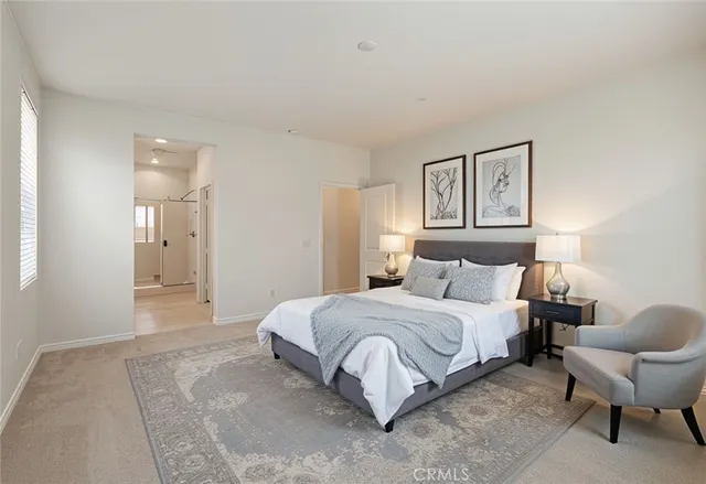 a bedroom with a bed and a painting on the wall